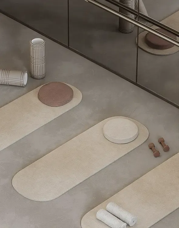 Contemporary yoga and training area with neutral tones and carefully selected accessories, designed by LUV Studio.